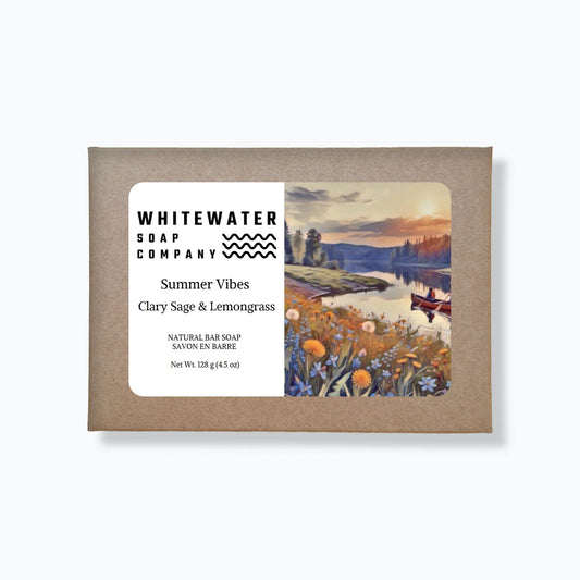 Bar of soap packaging with 'Summer Vibes' label and scenic design on a white background