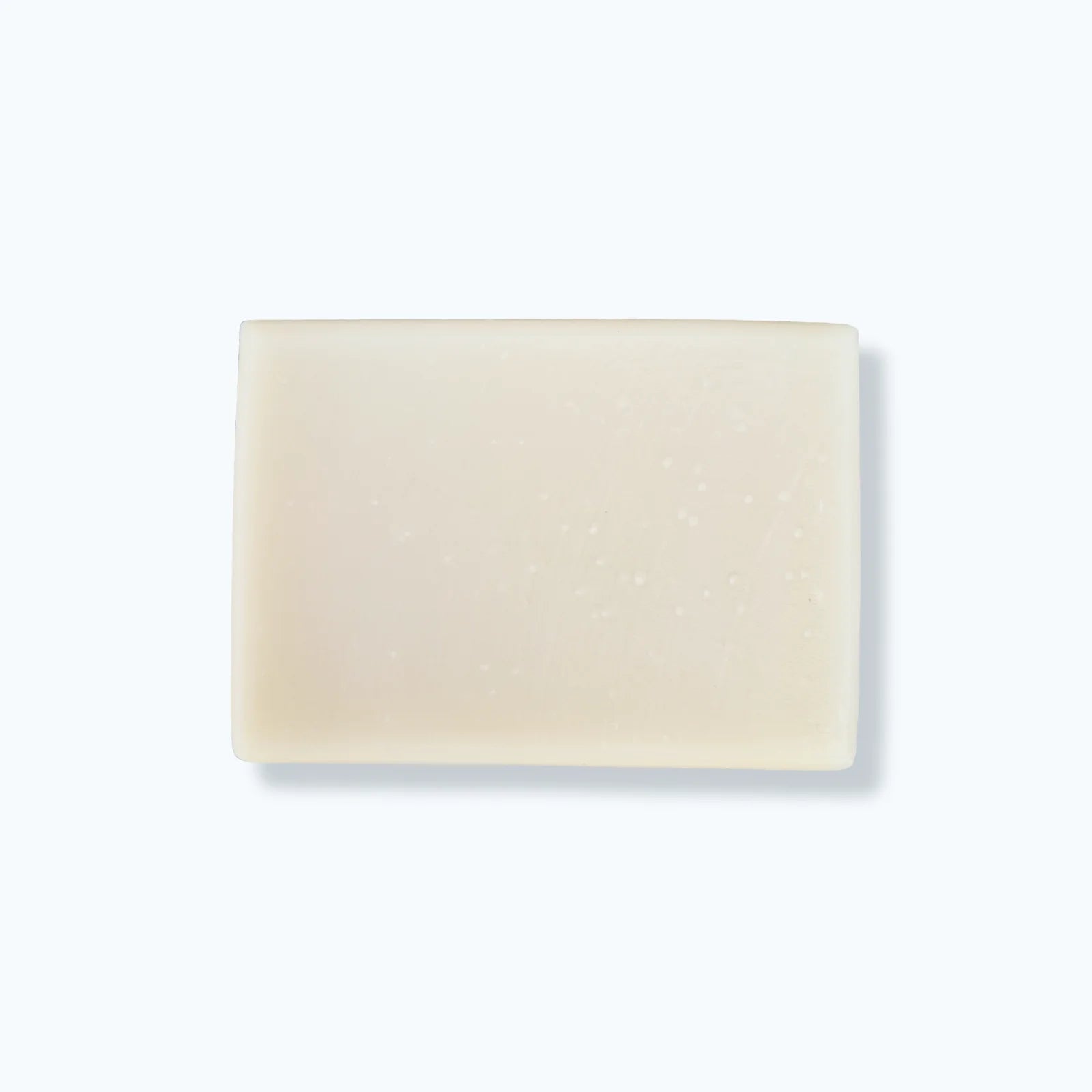 Beige soap bar on a light gray background