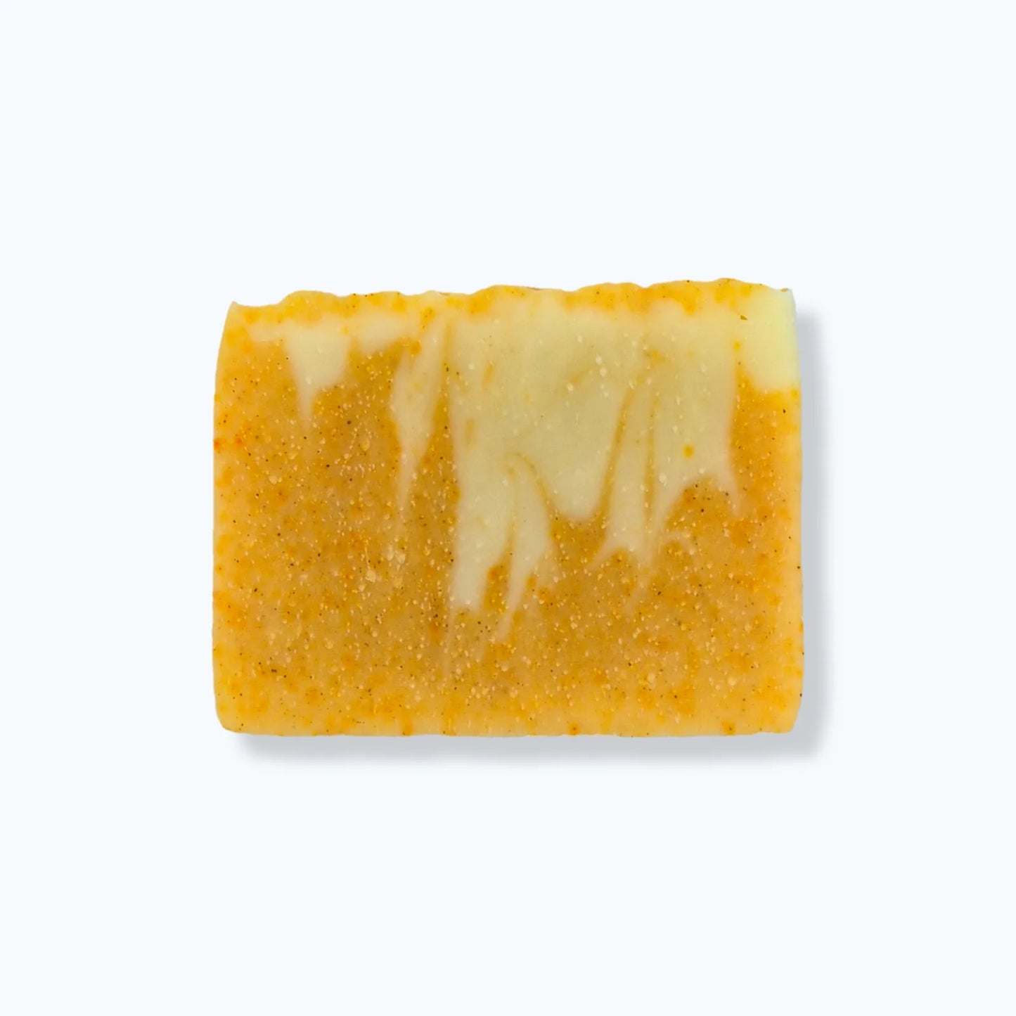 Yellow and white marbled soap bar on a white background