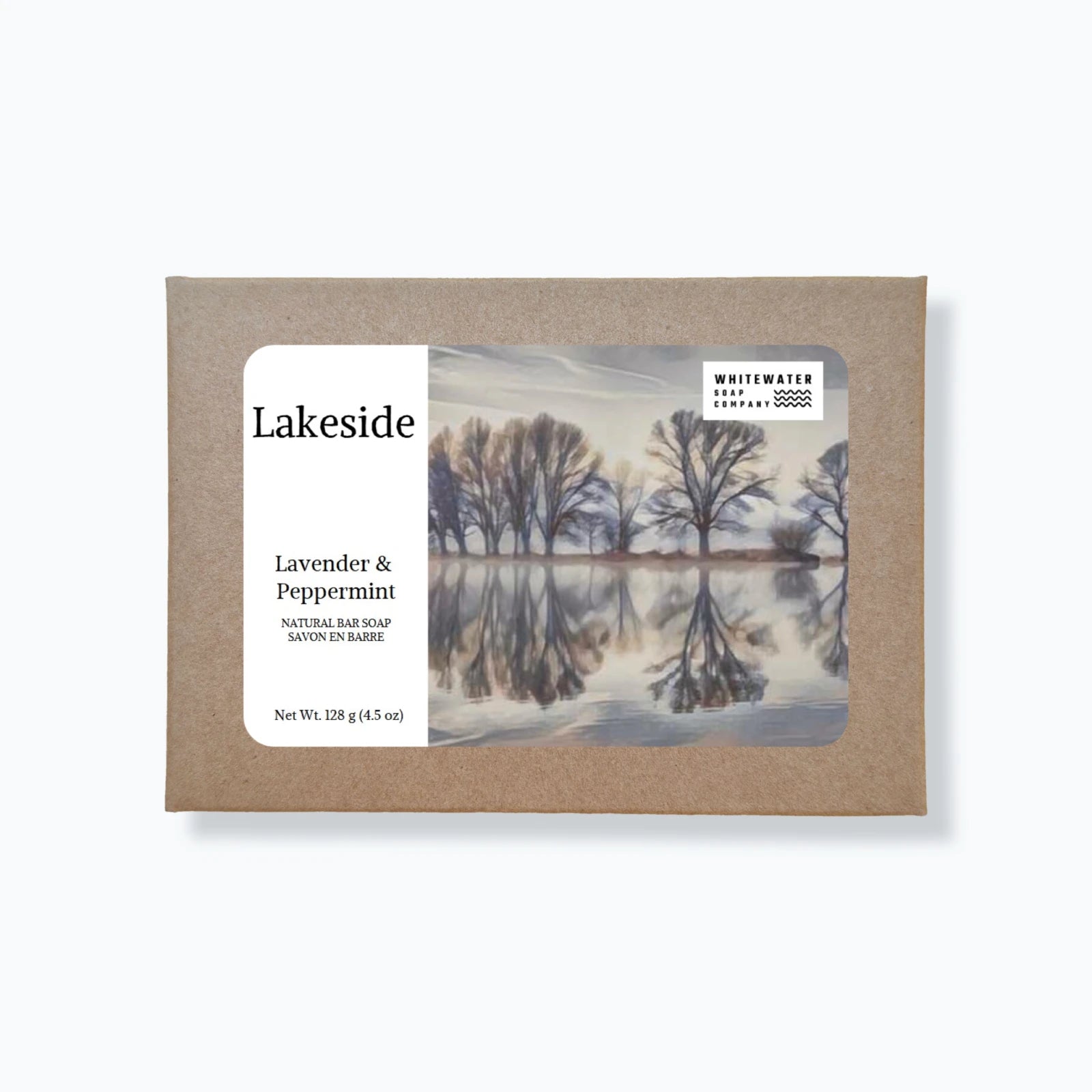 Soap packaging with a scenic image of trees reflected in water and text on a white background