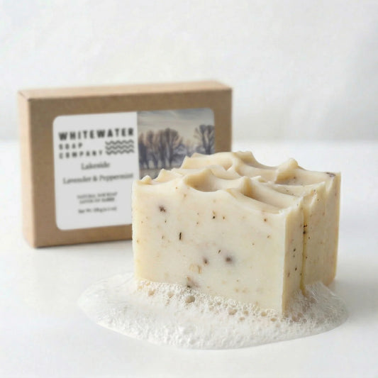 Bar of soap with a box labeled 'Whitewater Soap Company' on a white background