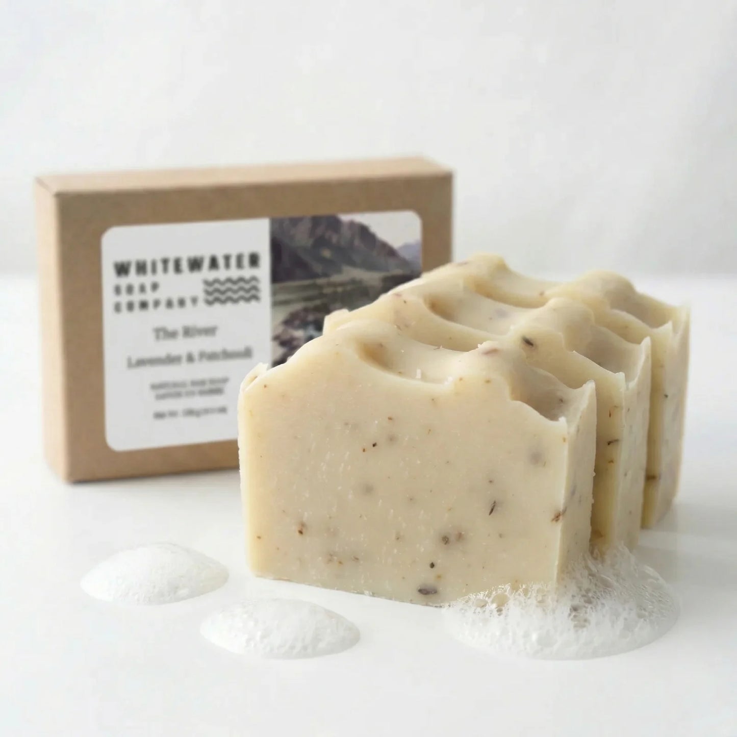 Bar of soap with a box labeled 'Whitewater Soap Company' on a white background
