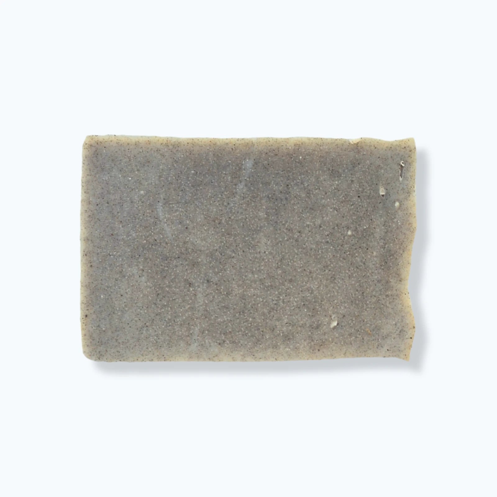 Rectangular bar of exfoliating soap on a white background