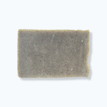Rectangular bar of exfoliating soap on a white background
