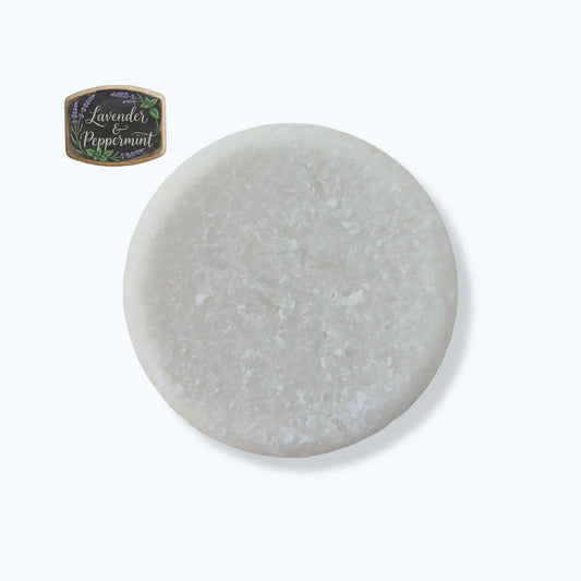 Round gray stone with a lavender peppermint label on a white background