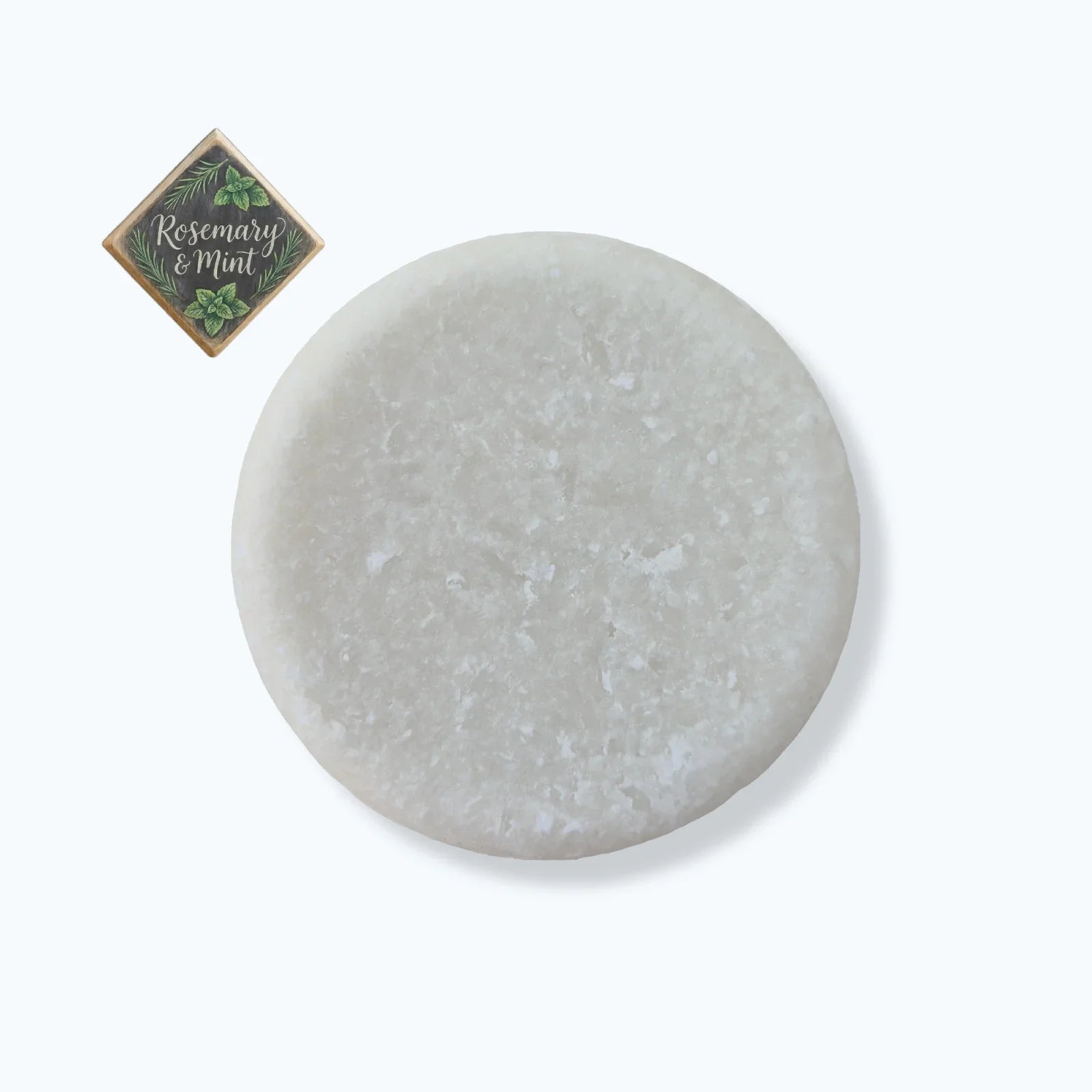 Round gray stone with a small square label on a white background