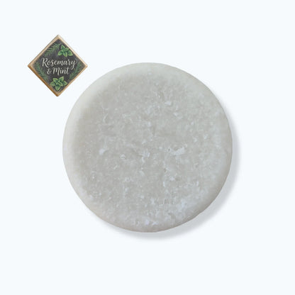 Round gray stone with a small square label on a white background