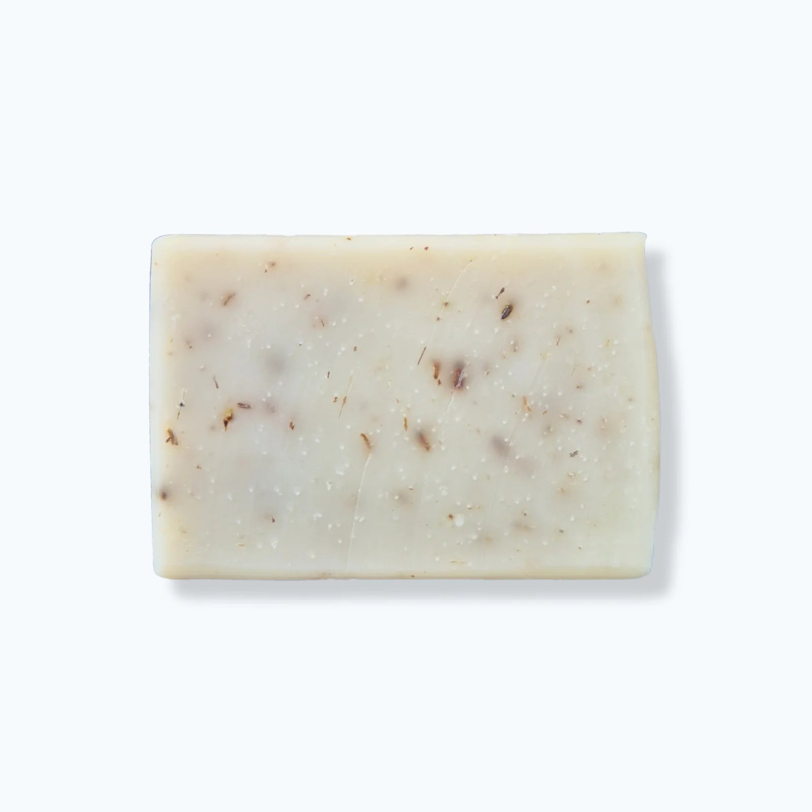 Bar of soap with lavender buds on a white background