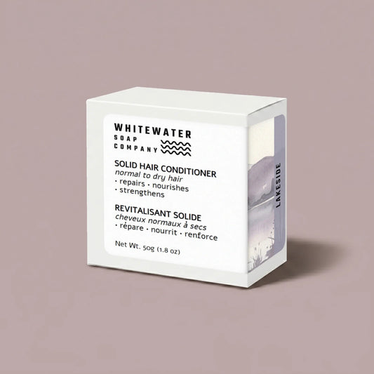 White box of Whitewater Soap Company solid hair conditioner on a beige background