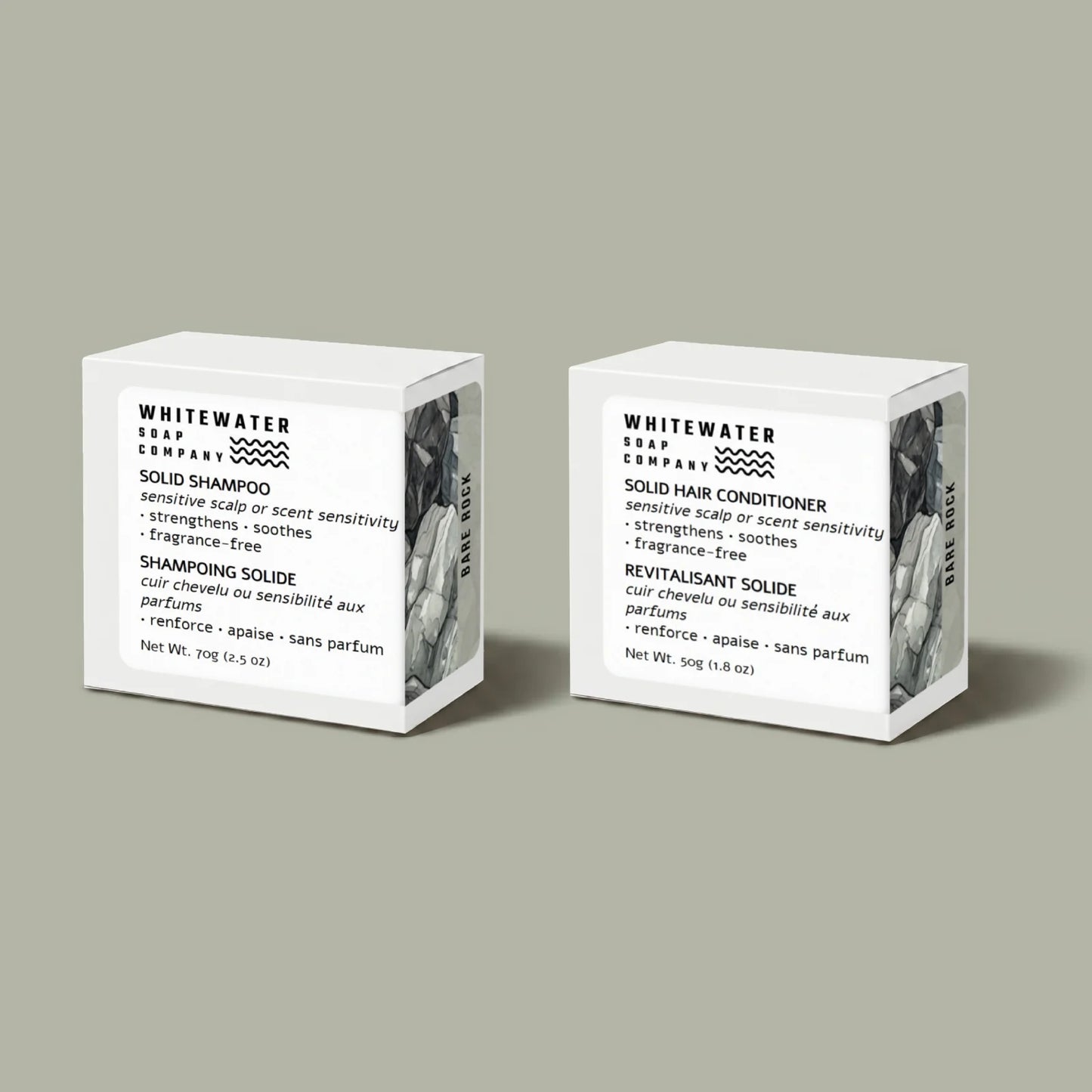 Two Whitewater Soap Company solid shampoo and conditioner bars on a gray background