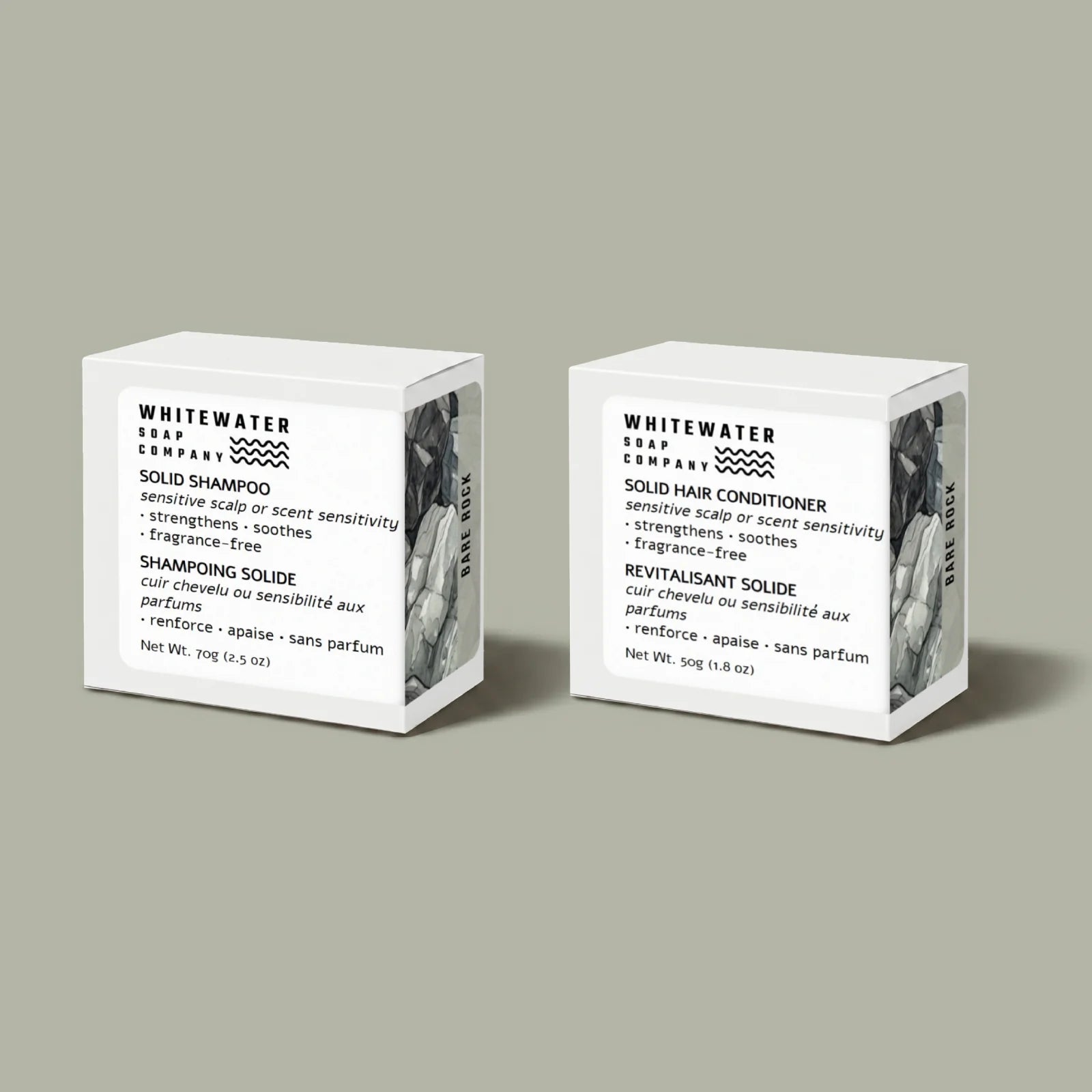 Two Whitewater Soap Company solid shampoo and conditioner bars on a gray background