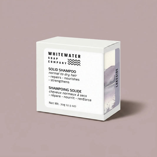 White box of Whitewater Soap Company solid shampoo on a beige background
