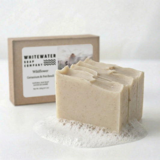 Bar of soap with a box labeled 'Whitewater Soap Company' on a white background