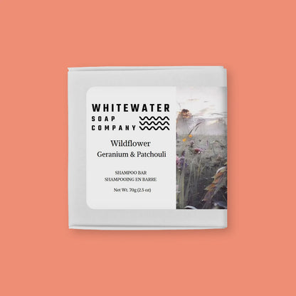 Whitewater Soap Company shampoo bar packaging on a peach background